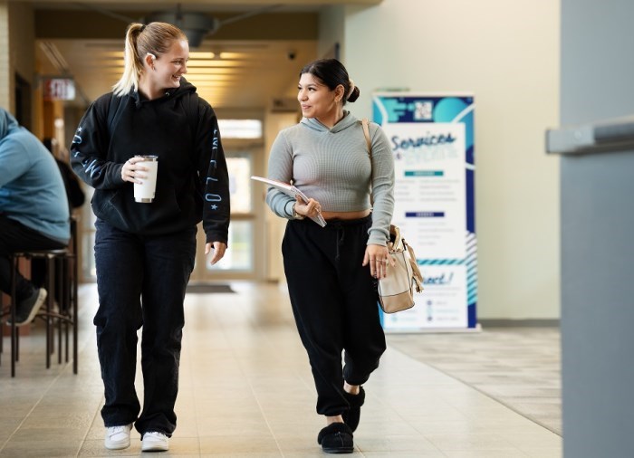 international students walking towards camera