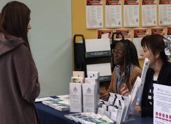 students speaking to academic integrity officer